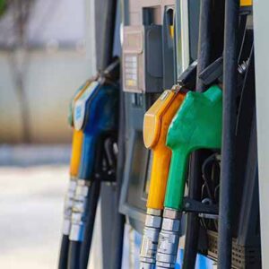 A close up of gas pumps on the side of road.